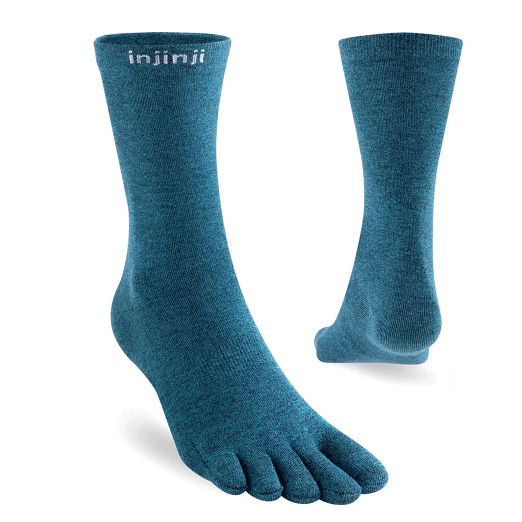 Pair of blue five-toe socks with 'injinji' branding on a white background - Injinji Liner Ultra Thin Crew Toesocks (Unisex) - Ocean