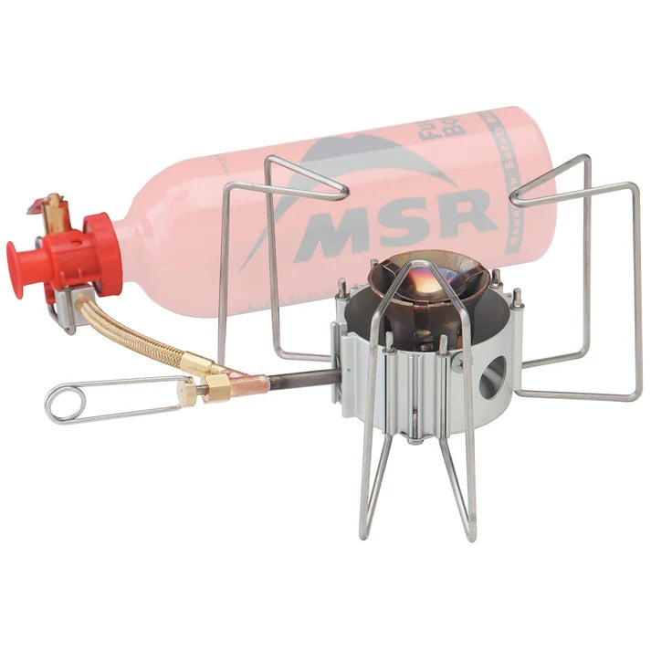 MSR camping stove with pink fuel canister on a white background - MSR Dragonfly Stove