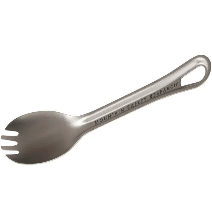 A stainless steel spork with a loop handle, featuring the engraved text 'MOUNTAIN SAFETY RESEARCH' on a plain white background. - MSR Titan Spork