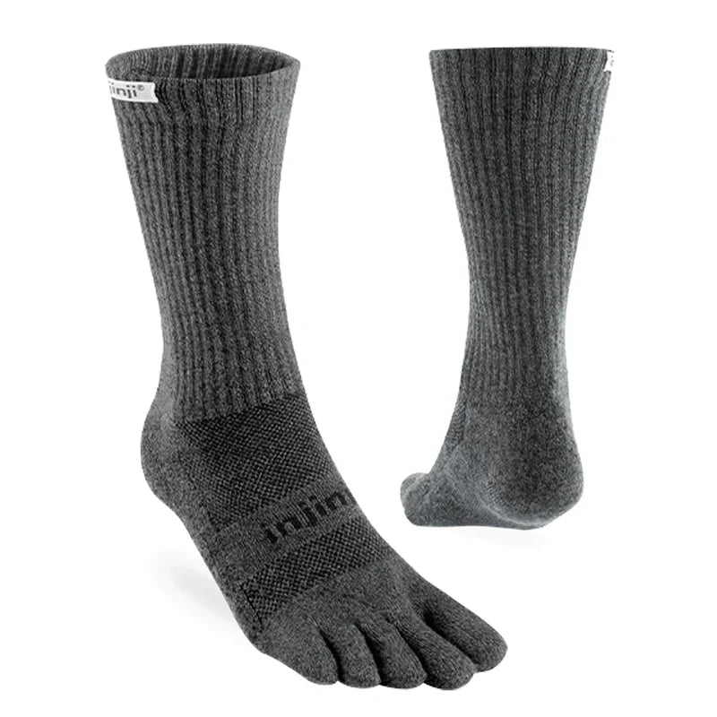 Pair of gray five-toe socks on a white background - Injinji Trail Midweight Crew Toesocks (Unisex) - Granite