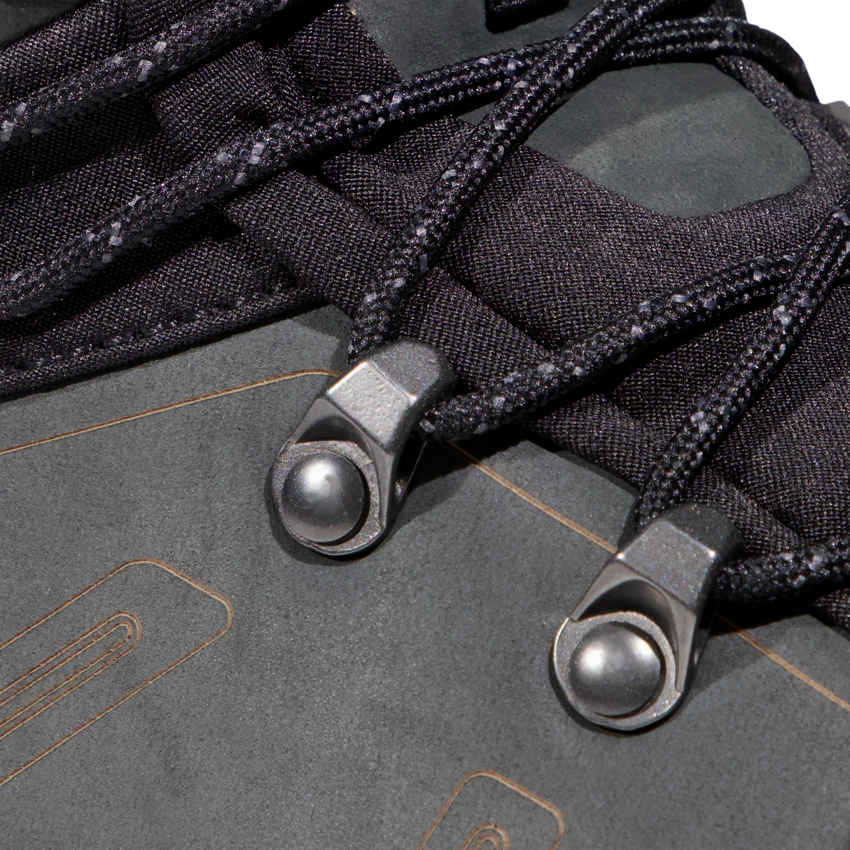 Close-up detail of black laces threaded through dark metal and fabric eyelets on a dark gray shoe upper. - Mammut Mercury Tour II High GORE-TEX (Men's) - Black/Black