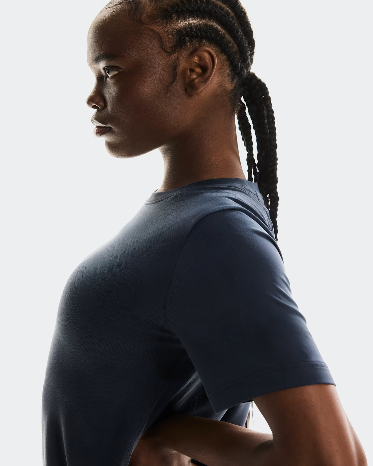 Person wearing a dark blue t-shirt against a light gray background - On Trail-T (Women's) - Navy