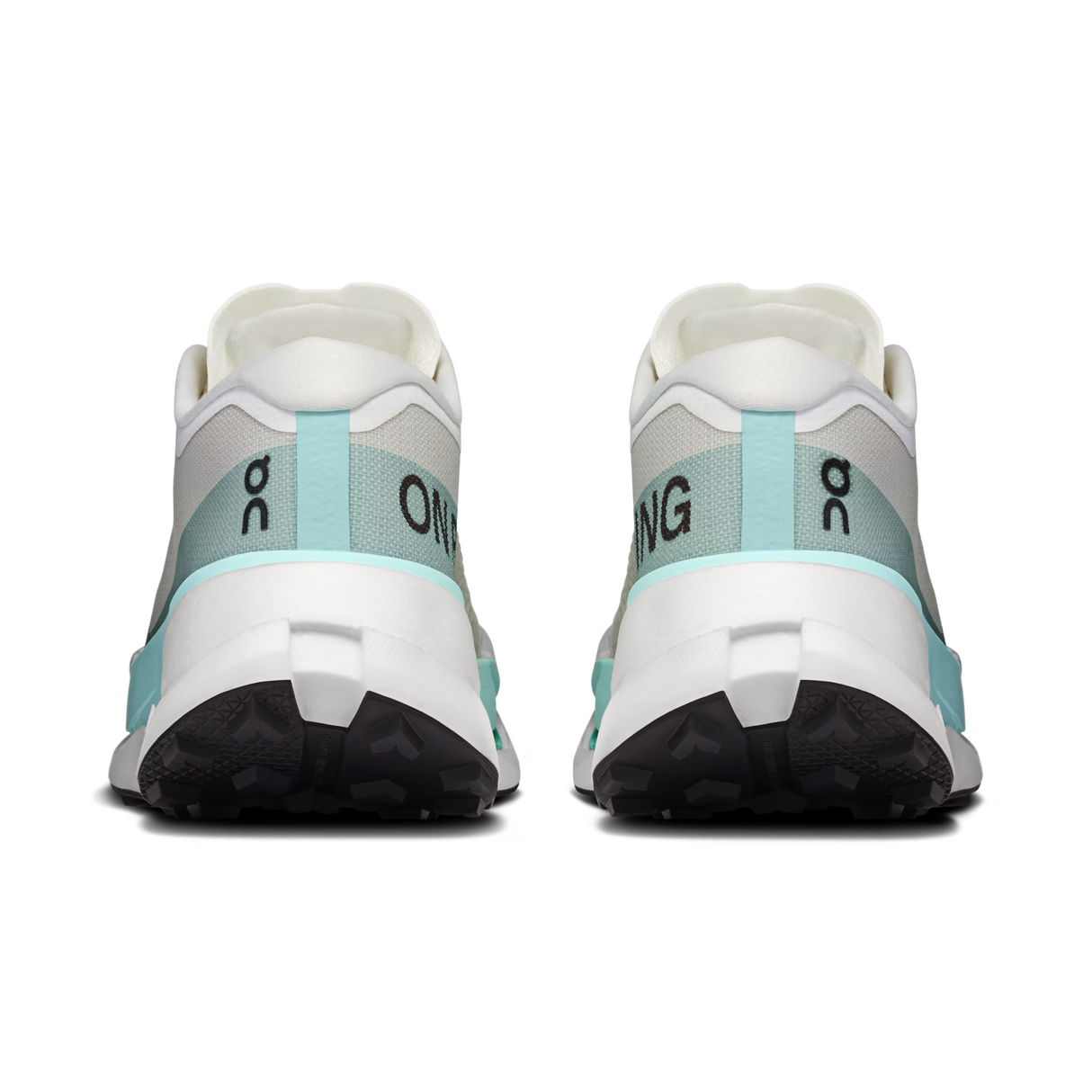 A pair of running shoes shown from the back, featuring a white and light gray upper with mint green accents and black outsoles. The brand logo 'on' is visible on the heel area. - On Cloudultra Pro Shoes (Women's) - Ivory/Celeste