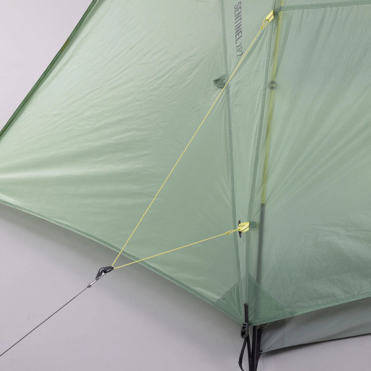 Green tent section with ropes on a light gray background - Sea to Summit Sentinel Tent
