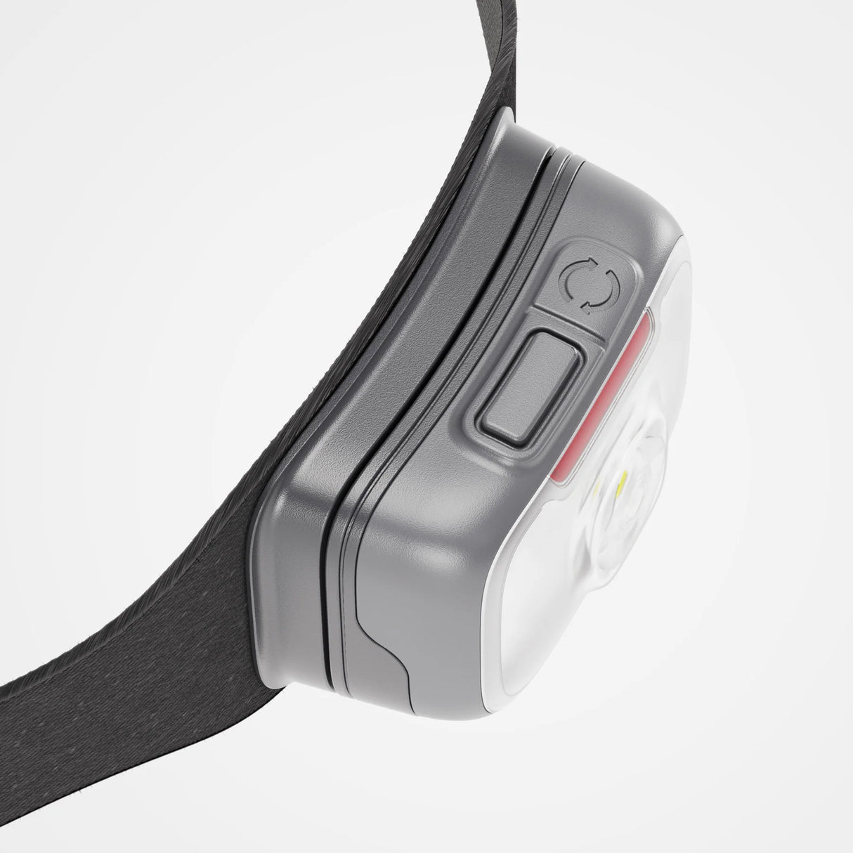 Close-up of a headlamp with a gray casing and black strap on a light gray background - Biolite Range 500 Headlamp - Midnight Grey