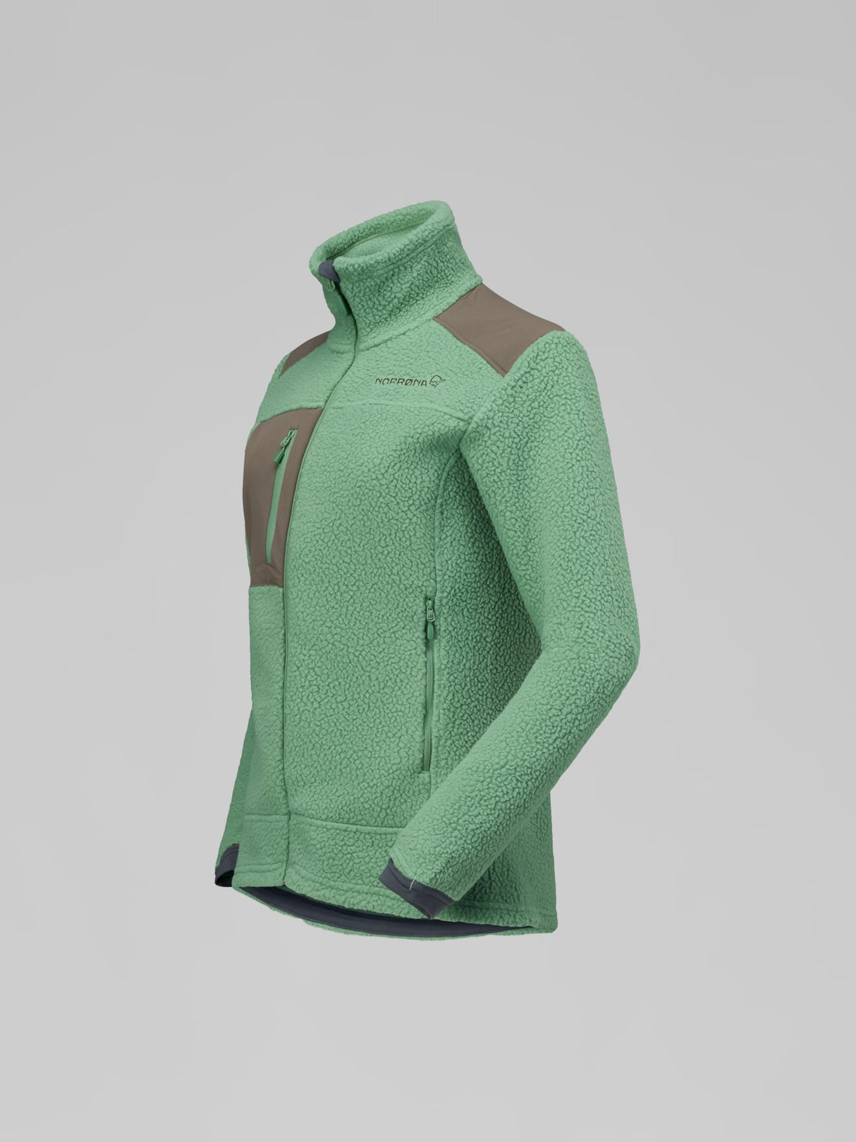 A green fleece jacket with brown color-blocked panels on the chest and shoulders, shown on a neutral gray background. - Norrøna Trollveggen Warm3 Jacket (Women's) - Dark Ivy