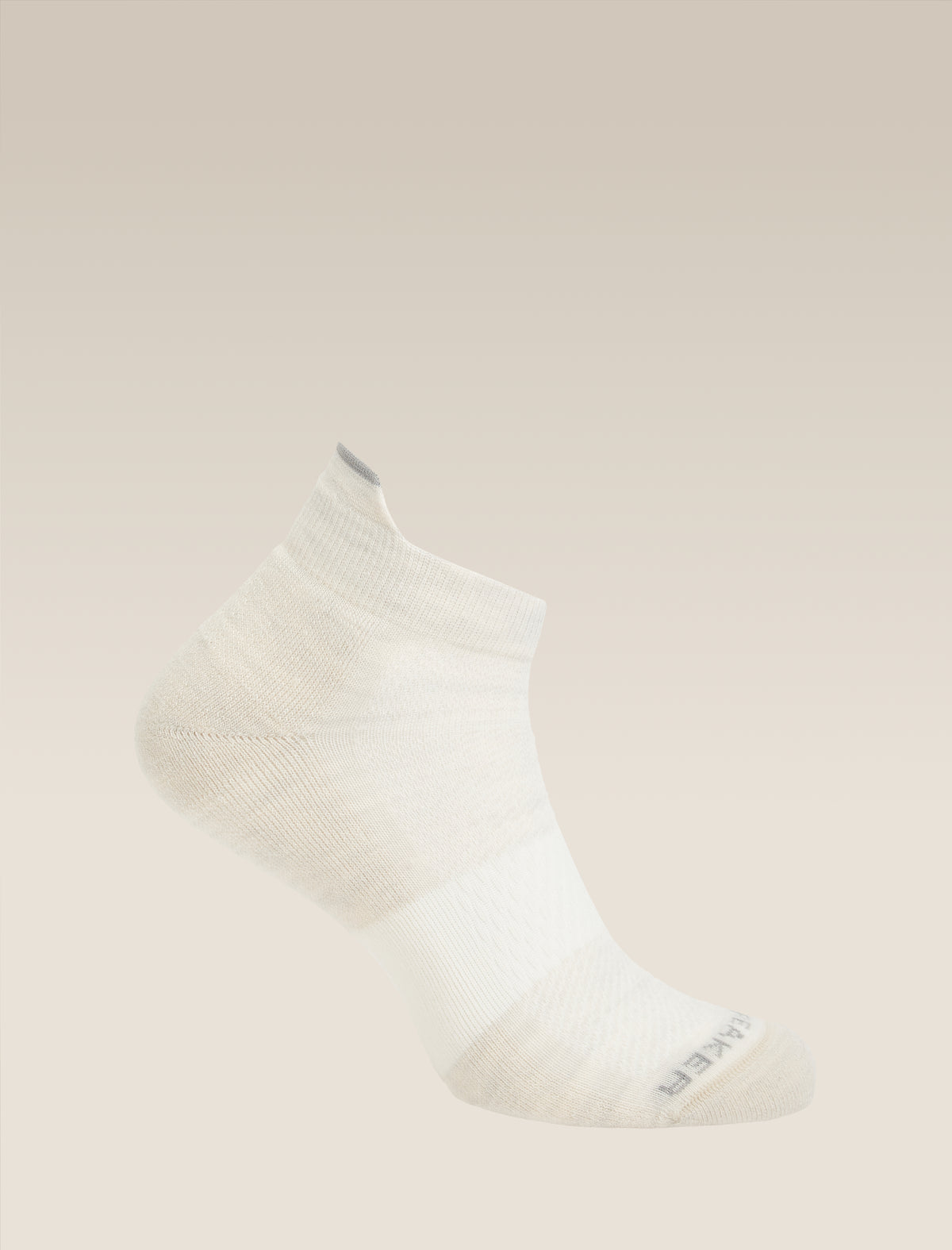 White ankle sock on a beige background - Icebreaker Merino Multisport Light Micro Socks (Men's) - Ecru Heather/Alloy/Snow