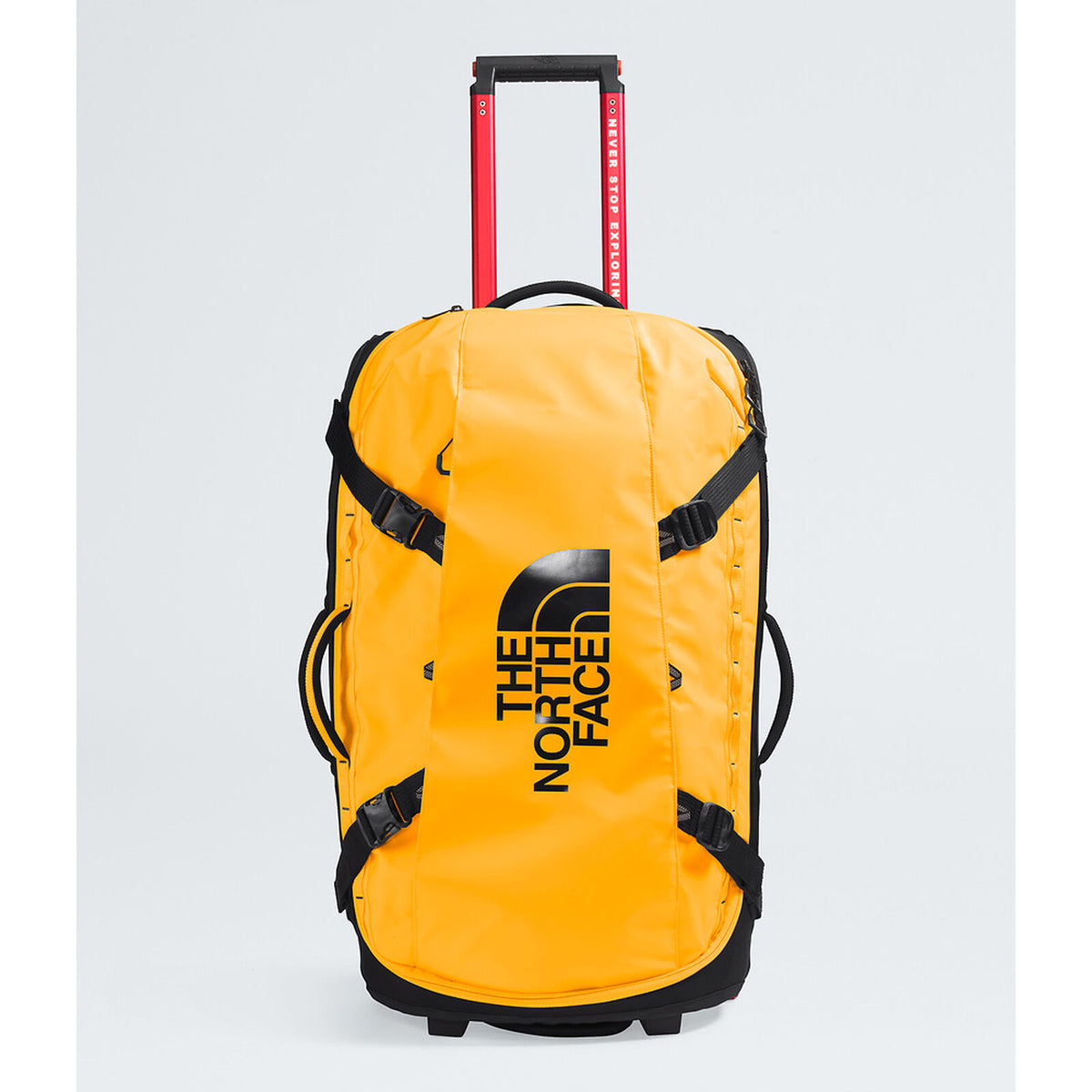 The North Face yellow rolling duffel bag with black straps, a black logo, and a red telescoping handle on a light gray background. - The North Face Base Camp Rolling Thunder 28" (95L) - Summit Gold/TNF Gold-NPF