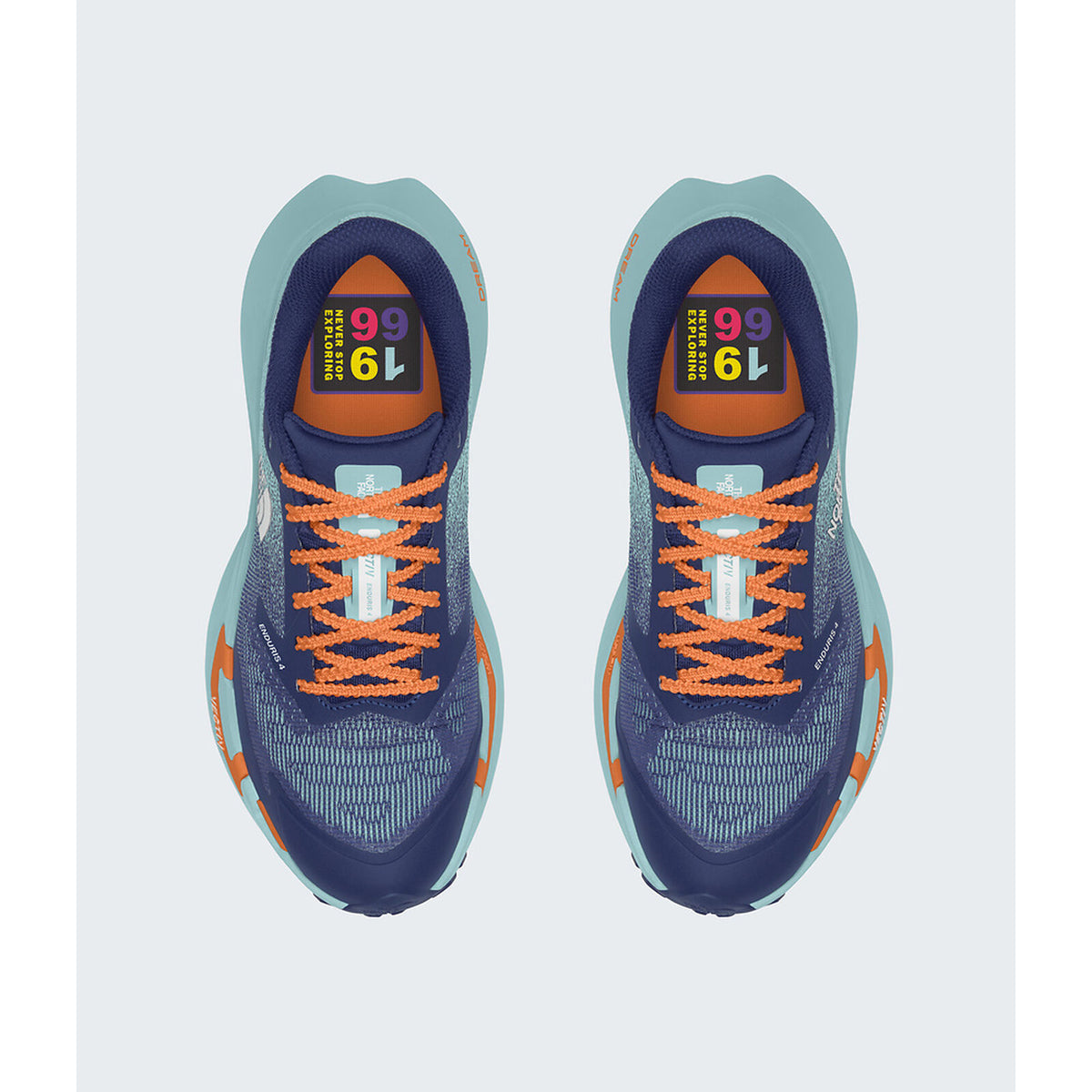 A pair of athletic running shoes shown from a top-down view on a light gray background. The shoes feature a navy blue mesh upper, a light teal midsole, bright orange laces, and orange accents on the sides and heel. - The North Face VECTIV Enduris 4 Shoes (Women's) - Bold Blue/Canal Blue