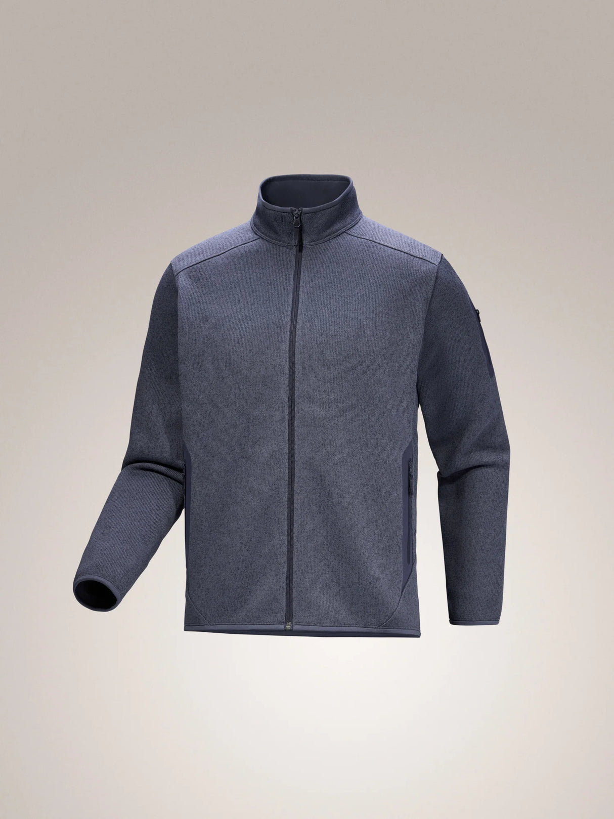 Gray fleece jacket on a beige background - Arc'teryx Covert Cardigan (Men's) - Dark Stratus Healther/Black Sapphire