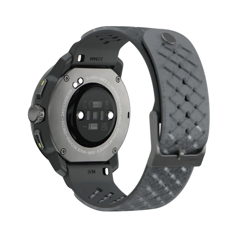 A rugged smartwatch shown from the back, featuring a dark gray textured silicone strap and a metallic gray circular sensor face on a white background. - Suunto Race S Titanium GPS Sports Watch