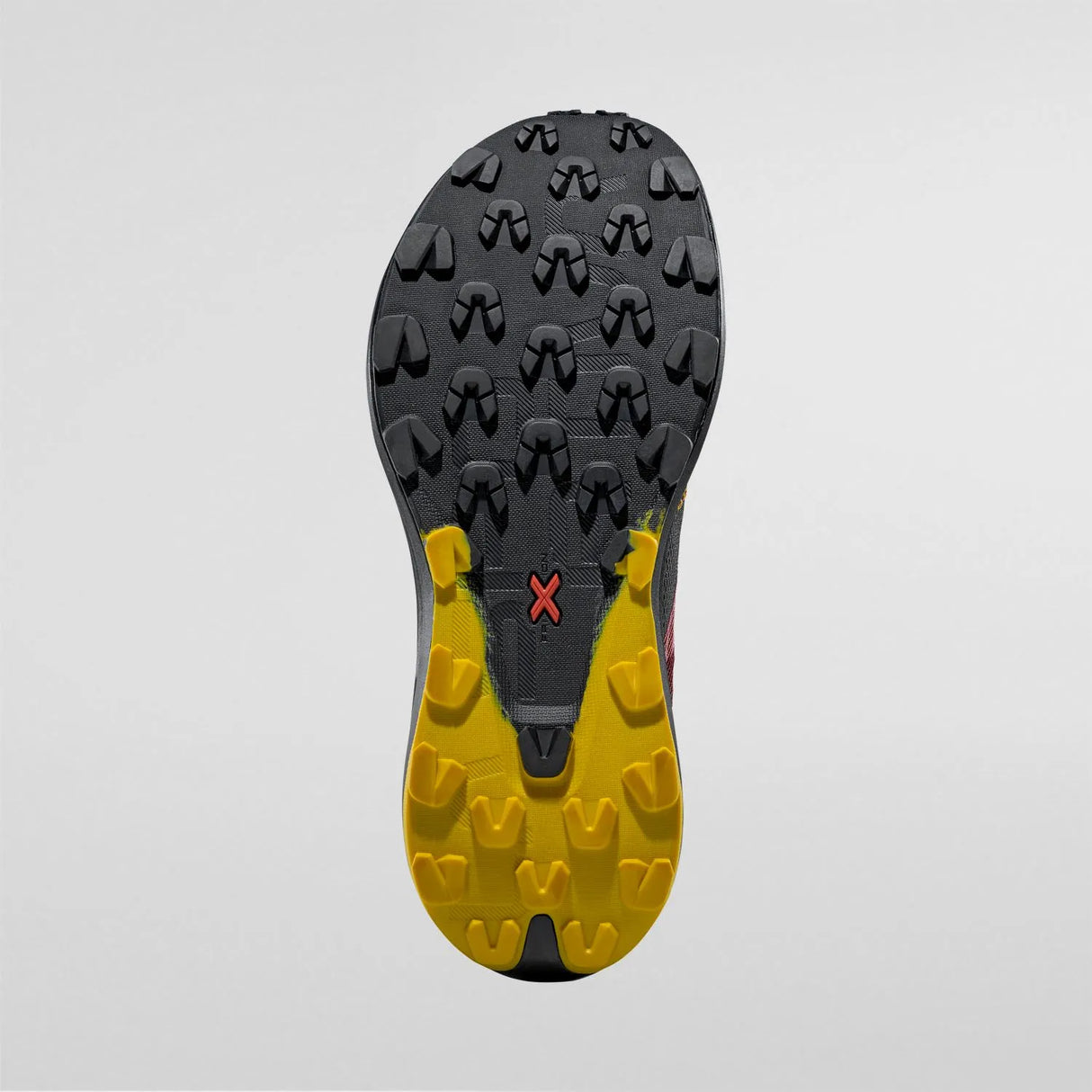 Close-up of a shoe sole with yellow and black tread pattern on a gray background - La Sportiva Prodigio Max Shoes (Men's) - Black/Yellow