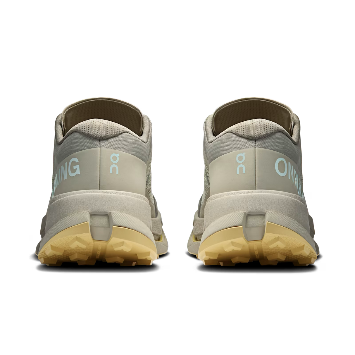 A pair of light gray and beige trail running shoes shown from the back, featuring light blue 'ON' branding and a gum-colored outsole, on a solid white background. - On Cloudultra 3 Shoes (Men's) - Brume/Winter