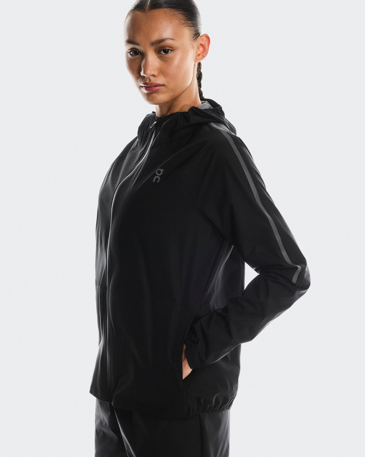 Person wearing a black jacket on a white background - On Performance Jacket (Women's) - Black