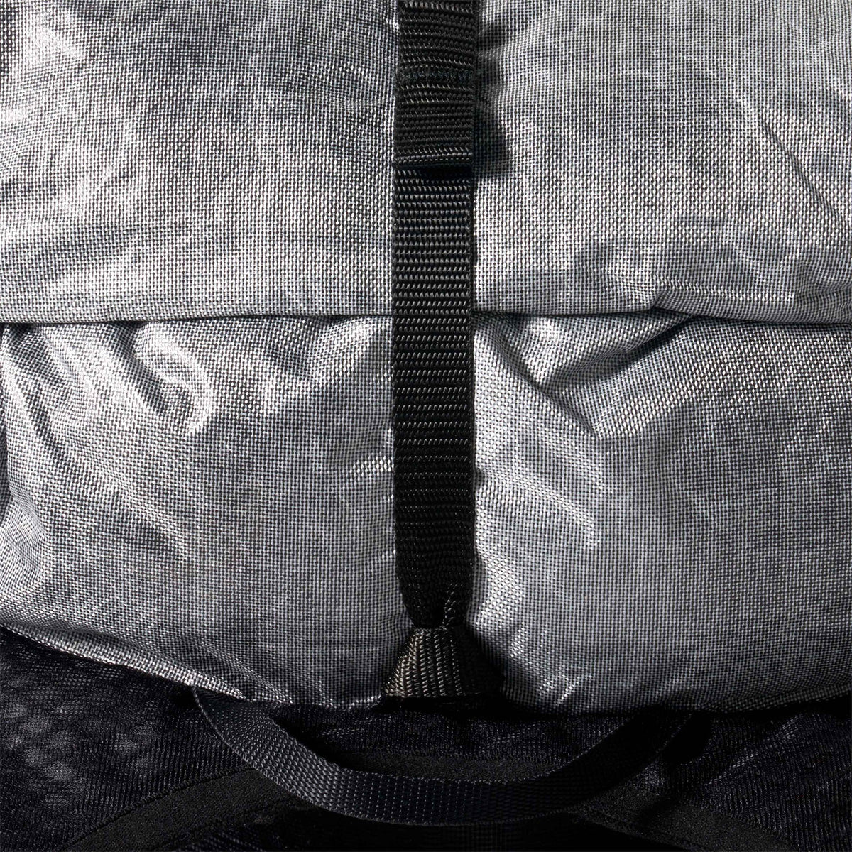 Close-up of a gray bag with a black strap - Hyperlite Mountain Gear Pemi 15 Backpack