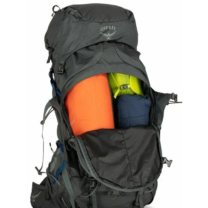 Osprey hiking backpack with colorful items inside on a white background - Osprey Aether Plus 70 Backpack (Men's) - Eclipse Grey