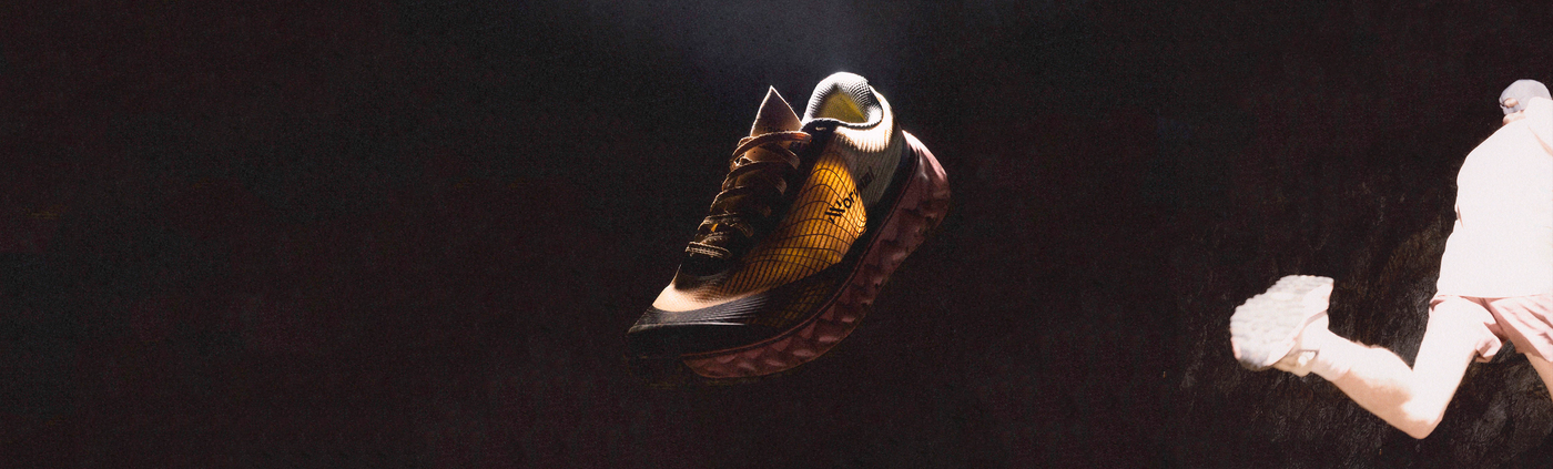 nnormal tomir 2 in green on a black background, in the side of the picutre is a guy running with the shoe