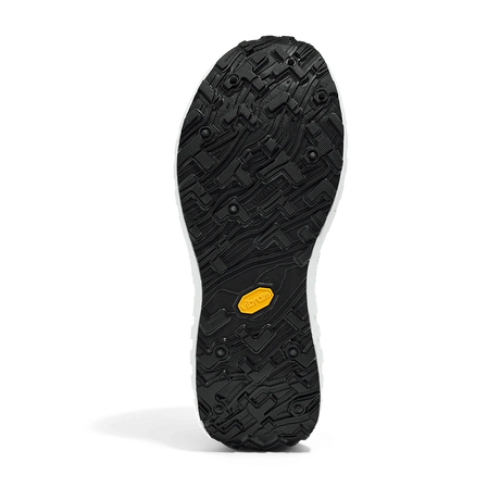 The black rubber outsole of a shoe, featuring a textured tread pattern and a small yellow Vibram logo near the heel, shown against a white background. - norda 001A Shoes (Women's) - Black