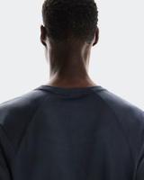 Back view of a person wearing a dark blue sweatshirt on a light gray background - On Trail-T (Men's) - Navy