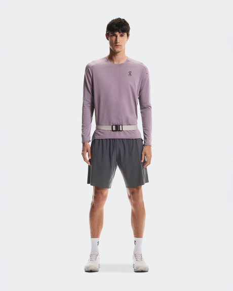 Man wearing a light purple long-sleeve shirt and gray shorts on a white background - On Speed Belt (Unisex) - Fog