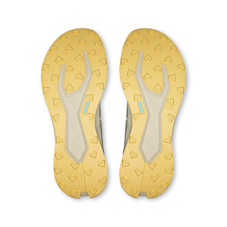 Top-down view of a pair of athletic shoes showing their yellow and beige outsoles with heart-shaped tread patterns and a small light blue accent. - On Cloudultra 3 Shoes (Men's) - Brume/Winter