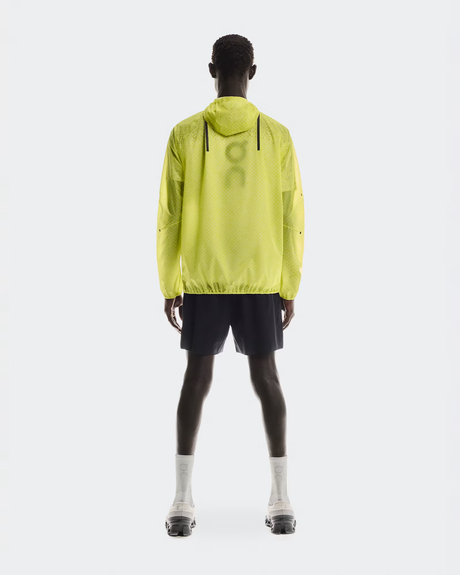 Person wearing a bright yellow jacket on a white background - On Ultra Jacket (Men's) - Limelight/Lime