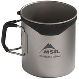 An MSR titanium camping mug with a black handle and a black silicone liner inside the rim, shown on a white background. - MSR Titan Cup