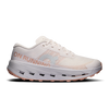 A single running shoe shown in a side profile on a clean white background. The shoe is primarily off-white/cream with a peach-pink 'ON RUNNING' text and logo on the side, a light gray logo, and a peach-pink outsole. - On Cloudultra 3 Shoes (Women's) - Oyster/Ether