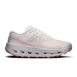 A single running shoe shown in a side profile on a clean white background. The shoe is primarily off-white/cream with a peach-pink 'ON RUNNING' text and logo on the side, a light gray logo, and a peach-pink outsole. - On Cloudultra 3 Shoes (Women's) - Oyster/Ether
