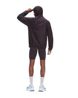 A man wearing a dark brown hooded windbreaker jacket and matching biker shorts, shown from the back against a solid white background. - On Ultra Jacket (Men's) - Urchin