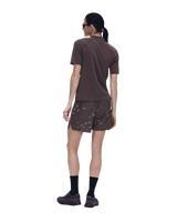 A woman shown from the back wearing a brown short-sleeve athletic shirt and matching brown shorts with a subtle tonal pattern, black socks, and running shoes against a plain white background. - On Trail-T Solar (Women's) - Mulberry