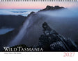 A 2027 wall calendar titled 'Wild Tasmania' featuring a dramatic mountain landscape with mist, rocky peaks, and a pink-and-blue dawn sky. The cover has a white band at the bottom with the title in large white letters and the year '2027' in red. - Rob Blakers Wild Tasmania 2027 Large Calendar