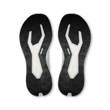 A pair of athletic shoe soles shown from the bottom, featuring a black textured tread with embossed heart-like patterns and a white central channel with a small mint green accent. - On Cloudultra Pro Shoes (Women's) - Ivory/Celeste