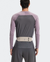 Person wearing a gray and purple long-sleeve shirt with a belt on a white background - On Speed Belt (Unisex) - Fog