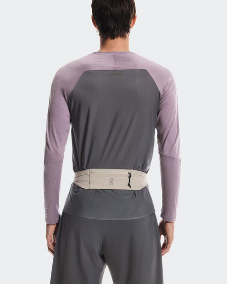 Person wearing a gray and purple long-sleeve shirt with a belt on a white background - On Speed Belt (Unisex) - Fog