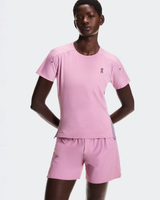 Person wearing a pink outfit with a logo on a white background - On Performance-T (Women's) - Dewberry/Sakura