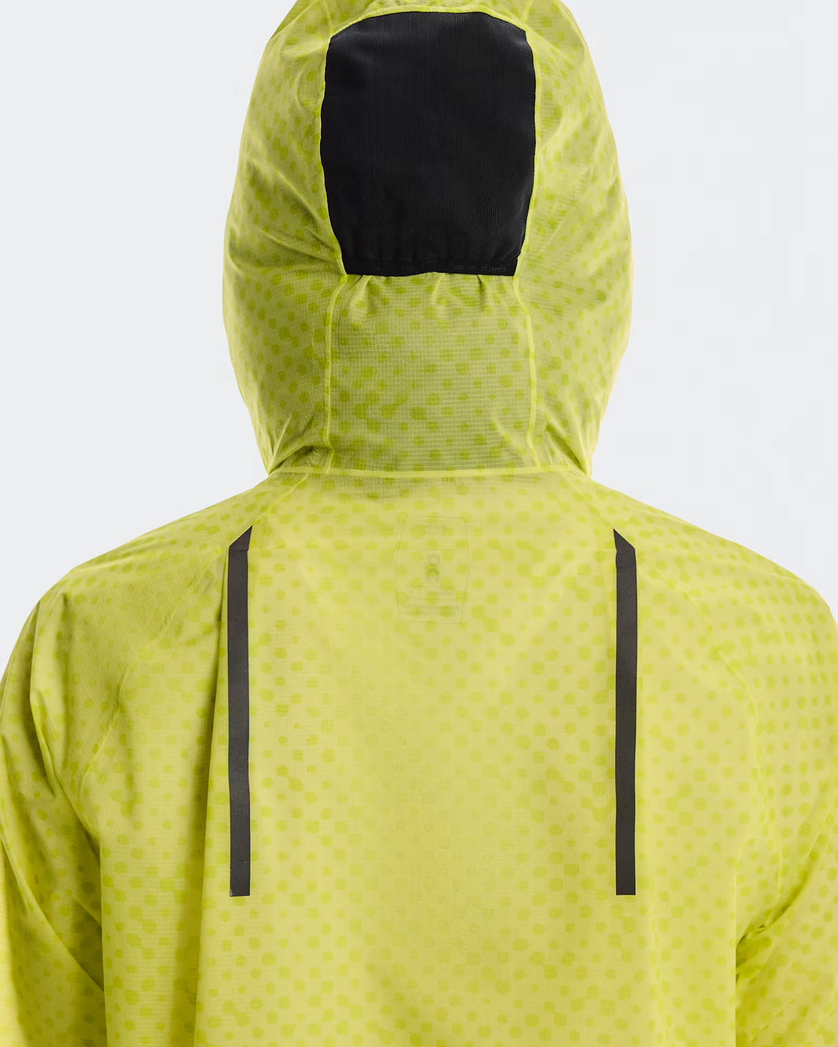 Yellow raincoat with black hood and side panels on a white background - On Ultra Jacket (Women's) - Limelight/Lime