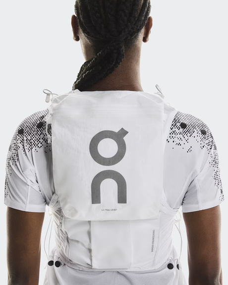 Person wearing a white vest with 'on' logo on a light gray background - On Ultra Vest Pro (Unisex) - White