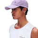 A man in profile wearing a light purple athletic cap with a perforated back panel and a white sleeveless top, photographed against a plain white background. - On Lightweight Cap - Mallow
