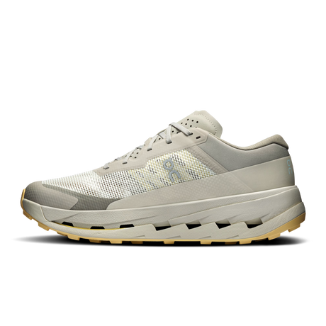 A single athletic trail running shoe shown in profile against a solid white background. The shoe features a light gray and off-white mesh and synthetic upper, a thick light gray midsole with a chunky gum outsole, and a small light blue logo on the side. - On Cloudultra 3 Shoes (Men's) - Brume/Winter