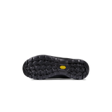 The black rubber outsole of a shoe, showing deep tread patterns and a small yellow Vibram logo on the heel, photographed against a solid white background. - Mammut Mercury Tour II High GORE-TEX (Men's) - Black/Black