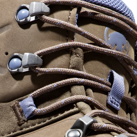 Close-up of a brown suede or nubuck lace-up boot with brown laces threaded through silver metal eyelets and blue webbing loops. A gray Mammut logo is visible on the side. - Mammut Nova Tour II High GORE-TEX Boots (Women's) - Oak/Bark