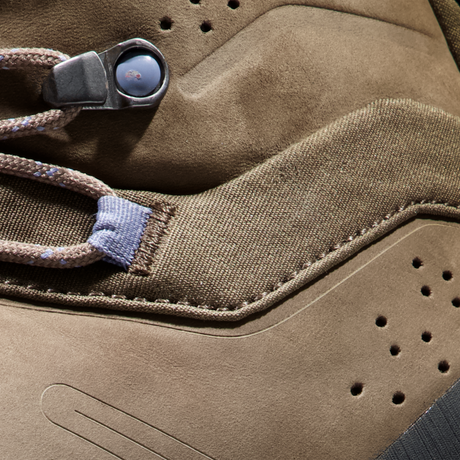 Close-up detail of a brown suede and canvas sneaker showing the laces, metal eyelets, stitching, and perforated toe area. - Mammut Nova Tour II High GORE-TEX Boots (Women's) - Oak/Bark