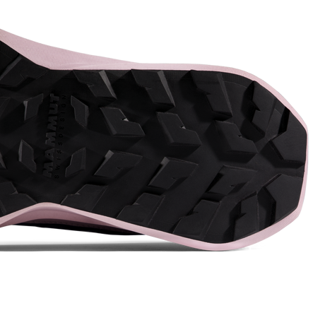 Close-up of the treaded black outsole of a running shoe, showing the Mammut logo embossed in the lug pattern and a light pink edge. - Mammut Aenergy Hike Low GORE-TEX Shoes (Women's) - Marine/Dark Alpine Calamint