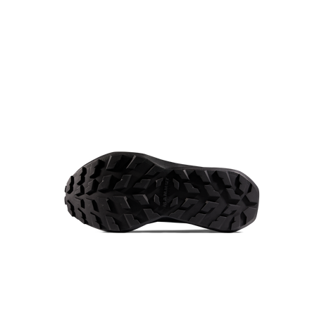 A close-up, bottom view of a black athletic shoe sole with a deep, aggressive tread pattern, shown against a plain white background. - Mammut Aenergy Hike Low GORE-TEX (Men's) - Strata/Black