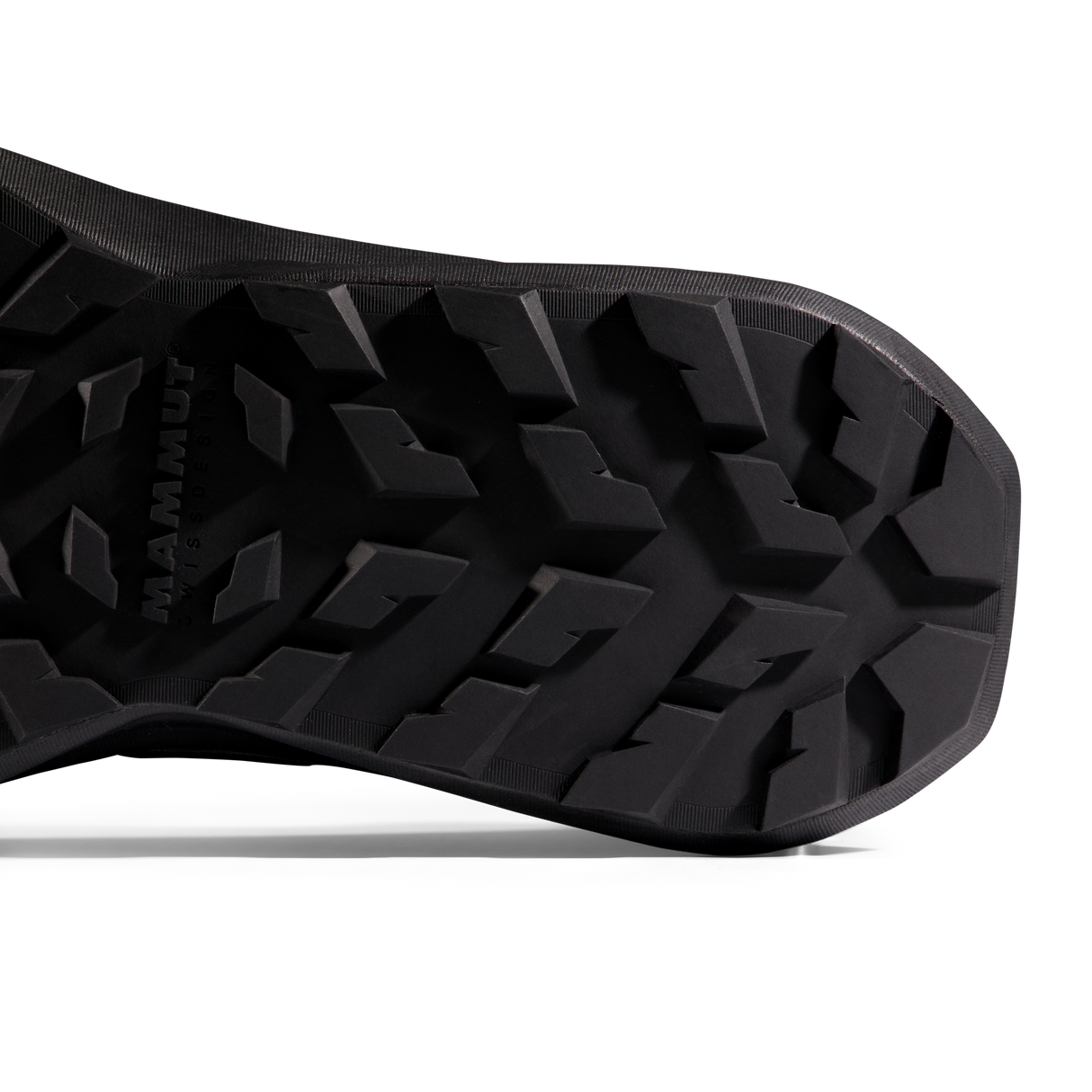 Close-up of the black treaded outsole of a shoe, with the brand name MAMMUT embossed on the left side, shown against a white background. - Mammut Aenergy Hike Low GORE-TEX (Men's) - Strata/Black