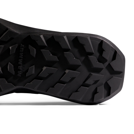 Close-up of the black treaded outsole of a shoe, with the brand name MAMMUT embossed on the left side, shown against a white background. - Mammut Aenergy Hike Low GORE-TEX (Men's) - Strata/Black