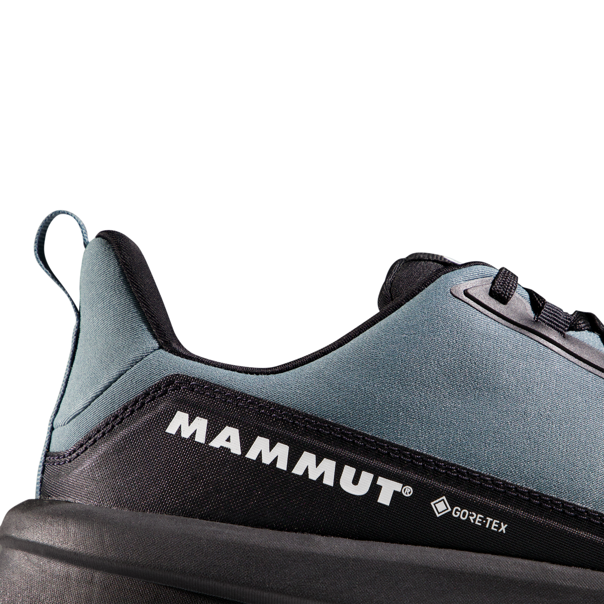 Close-up of the heel and side of a Mammut shoe in slate blue and black, showing the Mammut logo and a small Gore-Tex mark on a clean white background. - Mammut Aenergy Hike Low GORE-TEX (Men's) - Strata/Black
