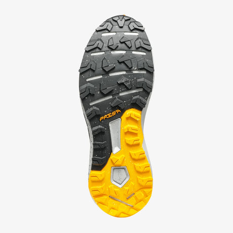 Close-up of a shoe sole with black and yellow tread pattern on a white background - SCARPA Spin Planet (Men's) - Anthracite/Saffron