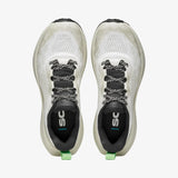 A pair of white and black running shoes shown from a top-down view on a light gray background. The shoes feature black and white patterned laces, a black interior lining with the 'sc' logo, and small green pull tabs at the heel. - SCARPA Golden Gate LT (Women's) - White/Bright Aloe